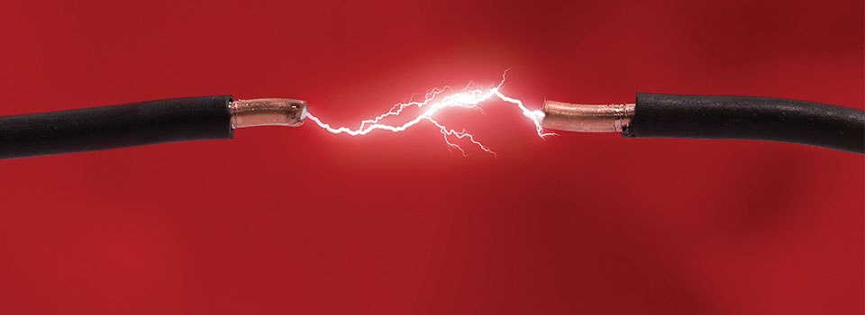 Aluminum electrical wiring showing exposed wires with electrical current, representing concerns when buying a house with aluminum wiring.
